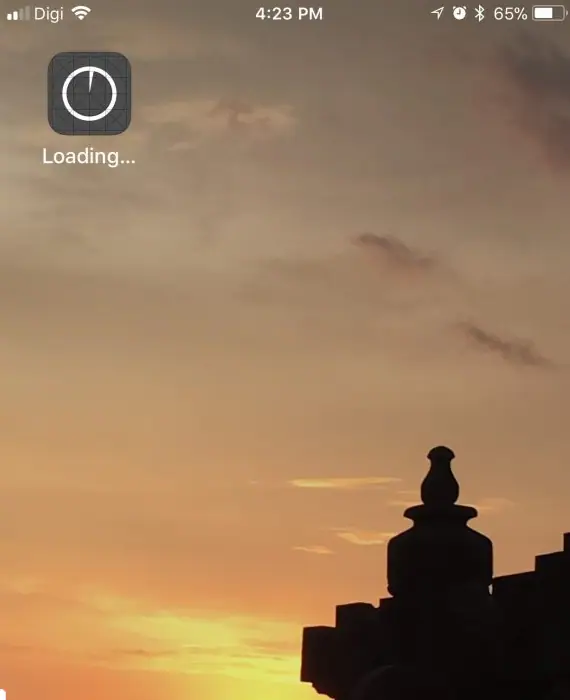 iPhone home screen with a new app icon showing Loading...