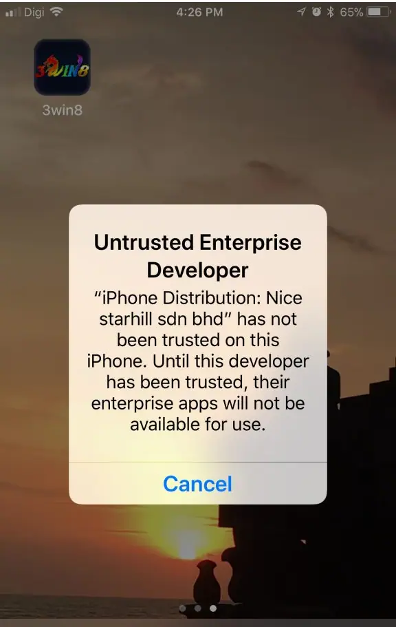 iOS warning Untrusted Enterprise Developer naming the distribution certificate and saying its apps will not be available until trusted, with a Cancel button