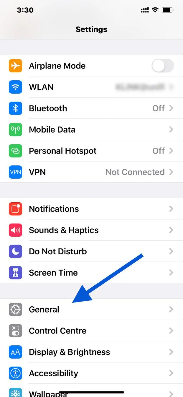 iPhone Settings screen with an arrow pointing to General